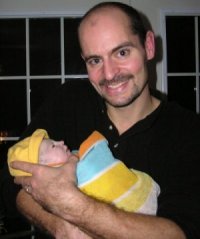 Photograph of Oliver and baby Ella.